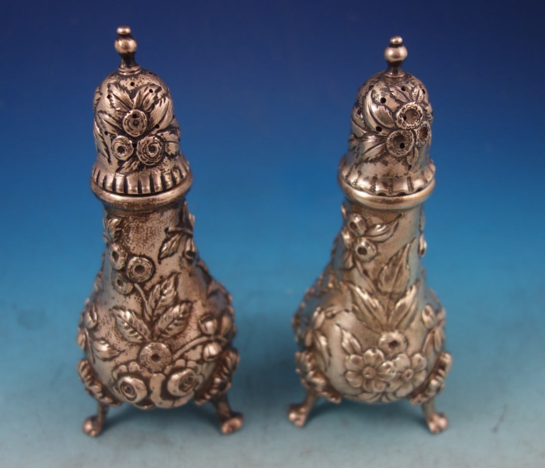 2-Piece Sterling Silver Footed Salt and Pepper Set Repousse Pattern: 2-Piece Sterling Silver Footed Salt and Pepper Set Repousse Pattern This is a footed salt and pepper shaker set crafted in sterling silver (.925) by Kirk in the Repousse pattern. The design, inspired 
