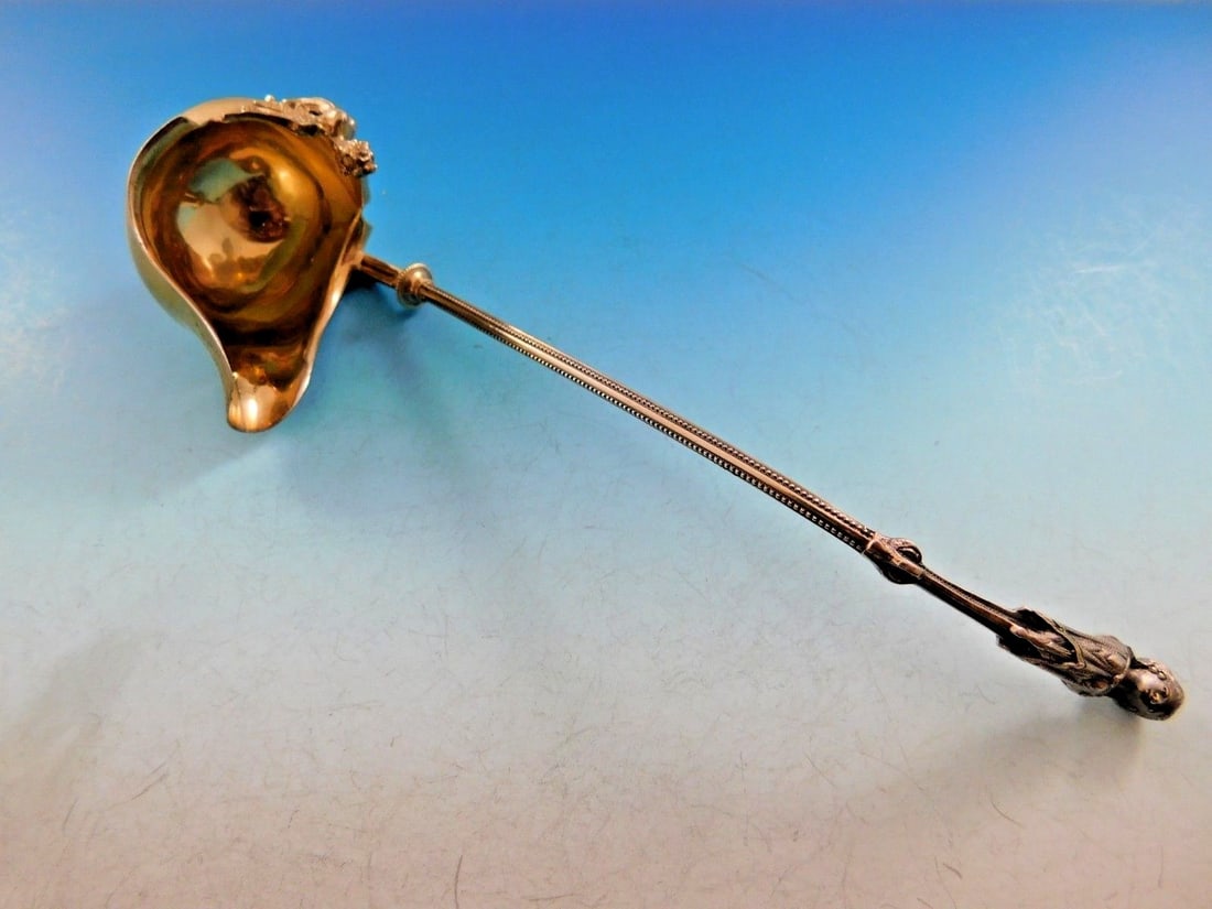 George Sharp Sterling Silver Sauce Ladle 1865 with Griffin and Woman: George Sharp Sterling Silver Sauce Ladle 1865 with Griffin and Woman This exquisite sterling silver sauce ladle by George Sharp dates back to the mid-19th century, specifically around 1865. The ladle 