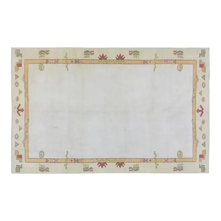 Hand Knotted Wool Anatolian Rug in Oushak Style 5'7 x 9' Vintage: Hand Knotted Wool Anatolian Rug in Oushak Style 5'7 x 9' Vintage This vintage Turkish Anatolian Oushak rug features a hand-knotted construction and a soft wool texture. It is presented in a white colo