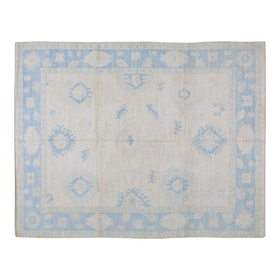 Turkish Oushak Hand Knotted Wool Rug 8'X10'2": Turkish Oushak Hand Knotted Wool Rug 8'X10'2" This early 21st-century Turkish Oushak rug is hand-knotted using wool and features natural tan colors with a soft texture. Its contemporary style makes it