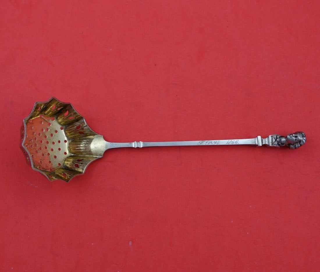 Gorham Bust Sterling Silver Sugar Sifter Ladle Gold Wash Figure: Gorham Bust Sterling Silver Sugar Sifter Ladle Gold Wash Figure This exquisite sugar sifter ladle by Gorham features a unique Bust pattern, crafted from sterling silver with a beautiful gold wash fini