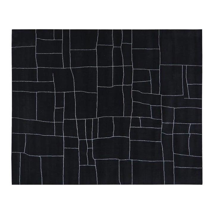 Black Hand Knotted Wool Moroccan Rug 9'2x12: Black Hand Knotted Wool Moroccan Rug 9'2x12 This Moroccan wool rug is hand-knotted using traditional techniques, offering a blend of classic craftsmanship and contemporary design. Its durable and soft