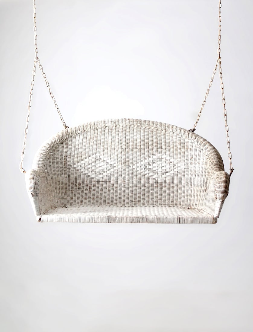 1930s to 1940s White Wicker Porch Hanging Bench with Diamond Back Detail: 1930s to 1940s White Wicker Porch Hanging Bench with Diamond Back Detail This vintage white wicker hanging bench from the 1930s-1940s features softly shaped arms, a woven seat, and a subtle diamond we