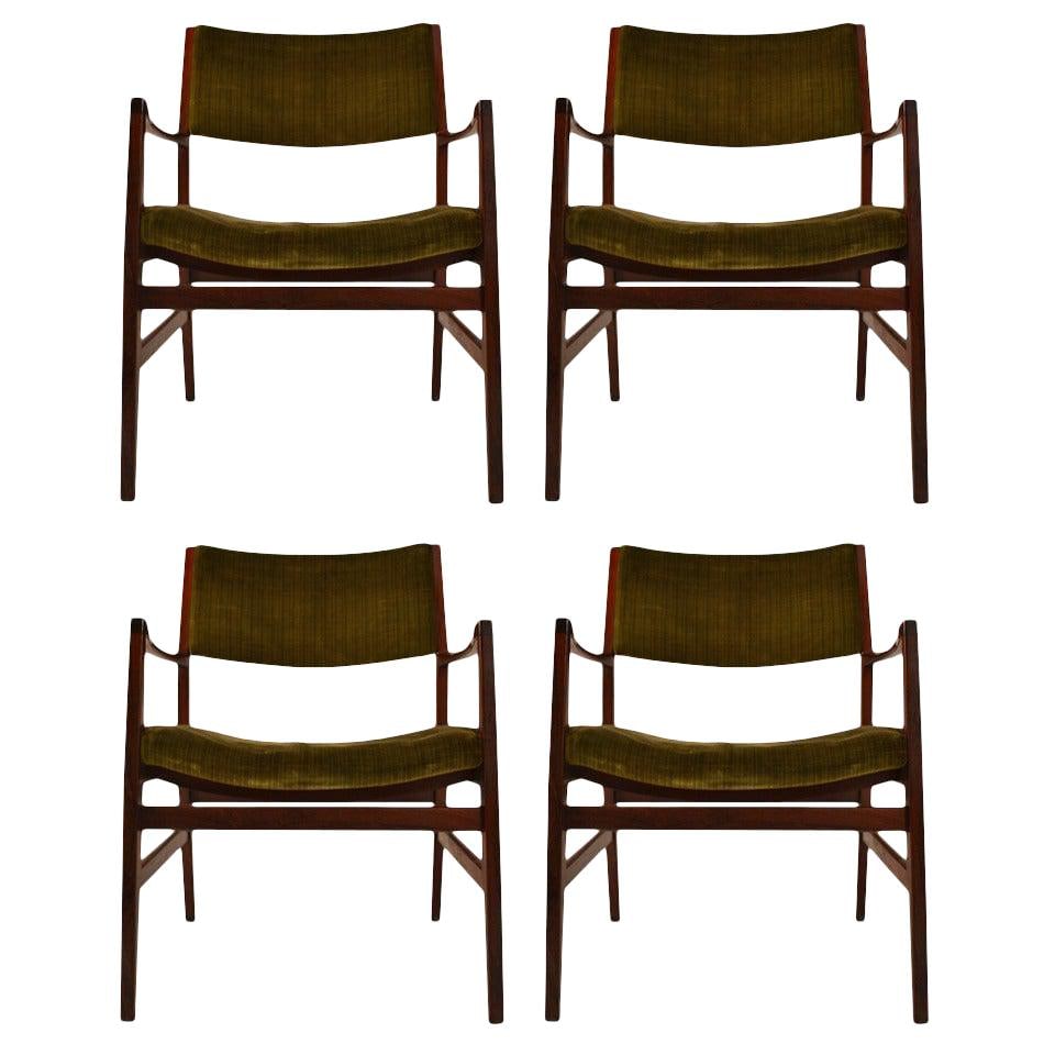 Set of Four Danish Rosewood Armchairs: Set of Four Danish Rosewood Armchairs This set of four rosewood armchairs features a well-designed and solid construction that likely reflects Danish craftsmanship, though they are unsigned. The chair