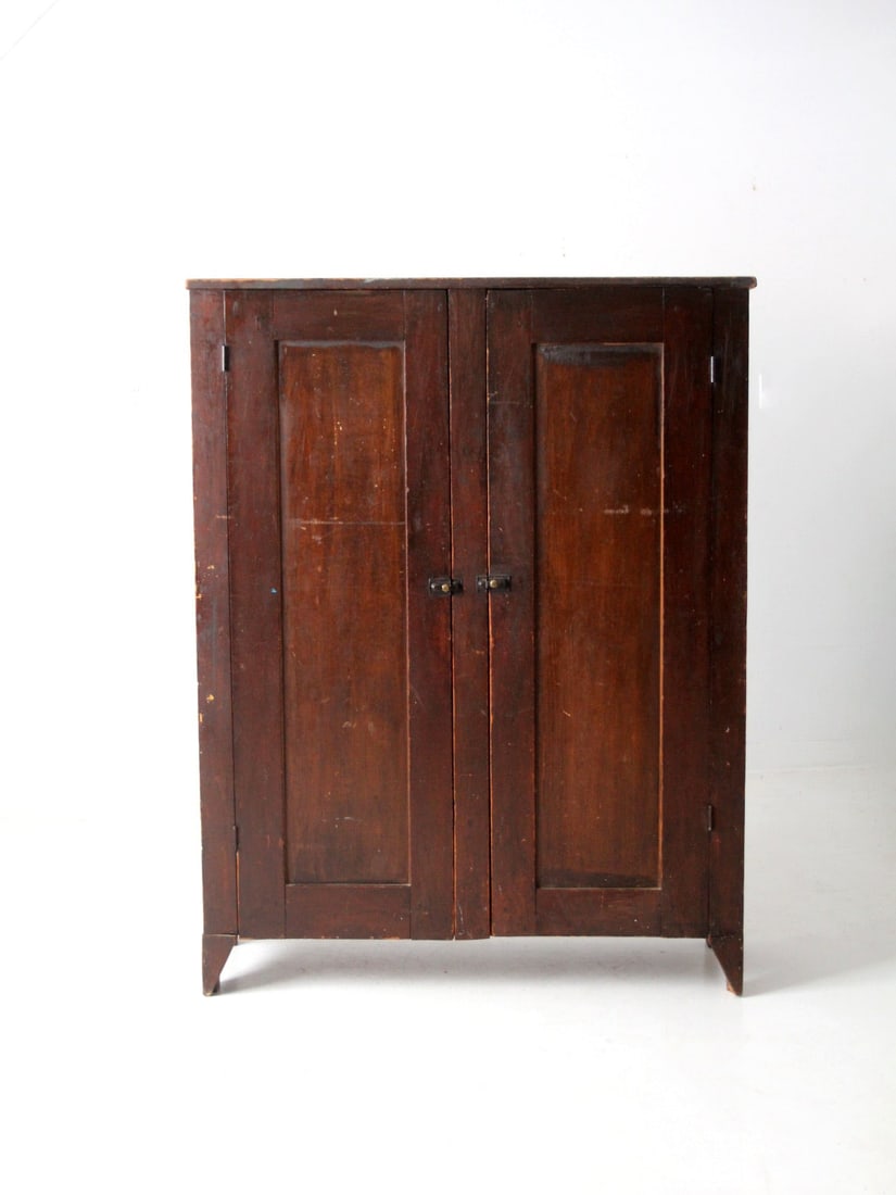 Vintage Rustic Antique Cupboard with Double Doors and 4 Shelves: Vintage Rustic Antique Cupboard with Double Doors and 4 Shelves Discover a charming antique cupboard that brings rustic elegance to any space. This vintage cabinet showcases paneled double doors that 