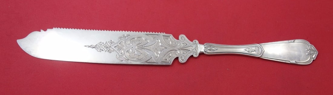 Vanderslice Gargoyle Sterling Silver Cake Saw 10 Inch Serrated Knife: Vanderslice Gargoyle Sterling Silver Cake Saw 10 Inch Serrated Knife Presenting a stunning Gargoyle cake saw crafted by Vanderslice, featuring a flat handle design. This exquisite piece is made of ste