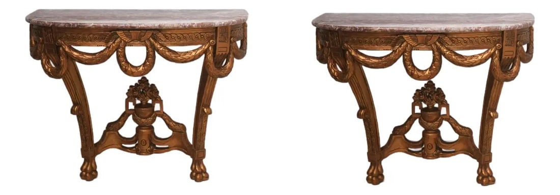 Set of Two Marble Top Louis XV Inspired Wall Consoles with Gold Finish: Set of Two Marble Top Louis XV Inspired Wall Consoles with Gold Finish This pair of French Louis XV style wall console tables features ornate carved details and quality construction. Each table is top