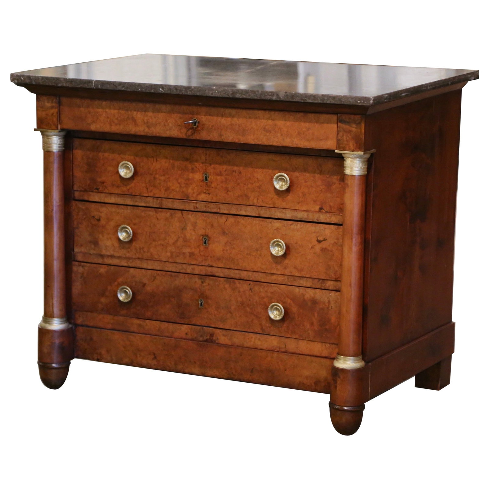 French Empire Fruitwood Commode with Black Marble Top Circa 1870: French Empire Fruitwood Commode with Black Marble Top Circa 1870 This mid-19th century French Empire chest of drawers features a richly figured fruitwood veneer over elm, complemented by hand-carved d