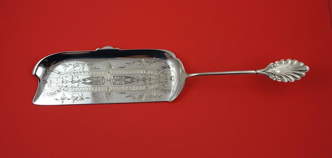 Grecian Gorham Sterling Silver 12 3/4 Crumber Brite-Cut: Grecian Gorham Sterling Silver 12 3/4 Crumber Brite-Cut This exquisite Grecian crumber by Gorham showcases the elegance of sterling silver with a stunning brite-cut finish. Measuring 12 3/4 inches, th