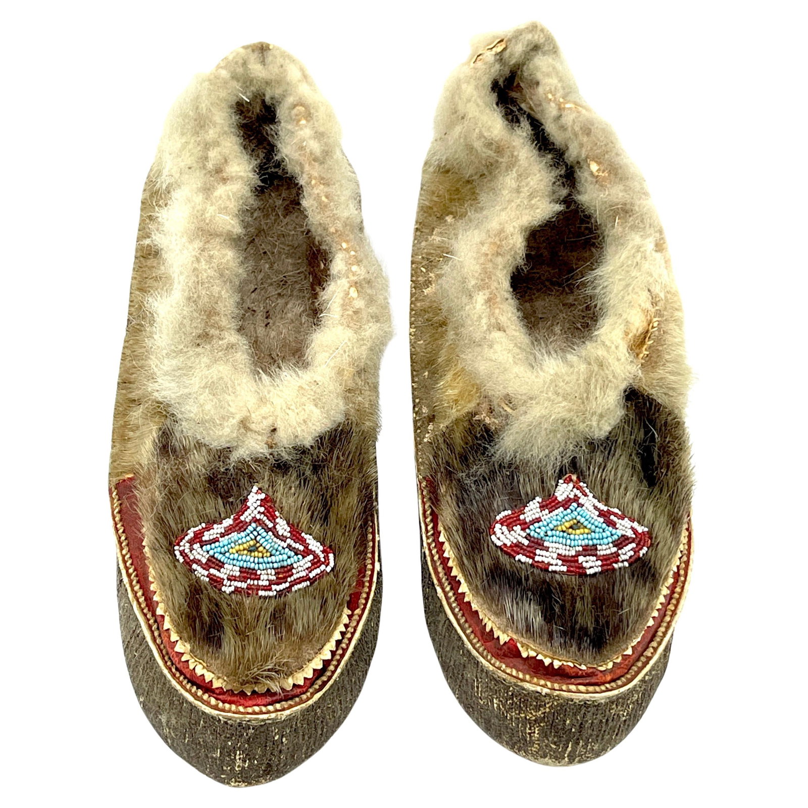 Set of 2 Vintage 20th Century Navajo Beaded Moccasins: Set of 2 Vintage 20th Century Navajo Beaded Moccasins This exquisite pair of 20th-century Navajo beaded moccasins exemplifies traditional Native American craftsmanship. Each moccasin measures 10 inche