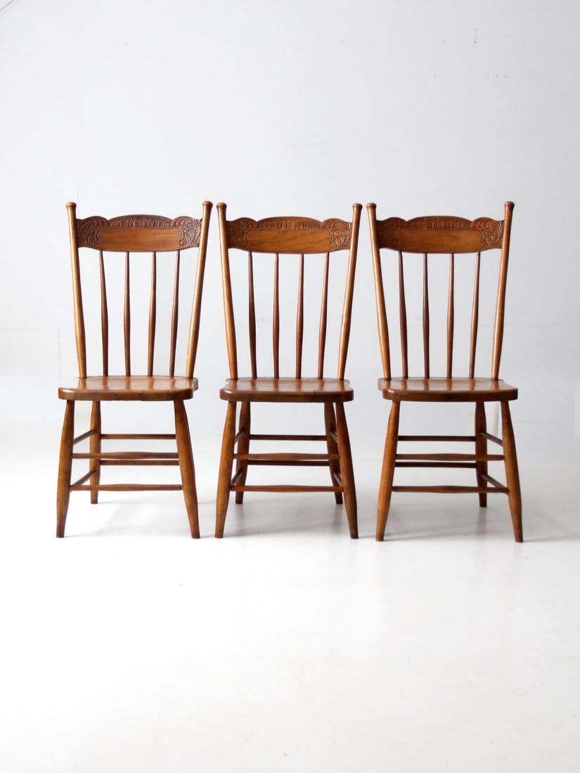 Set of 3 Antique Pressed Back Dining Chairs with Spindle Backs: Set of 3 Antique Pressed Back Dining Chairs with Spindle Backs Enhance your dining experience with this exquisite set of three antique pressed back dining chairs. These classic chairs showcase elegant