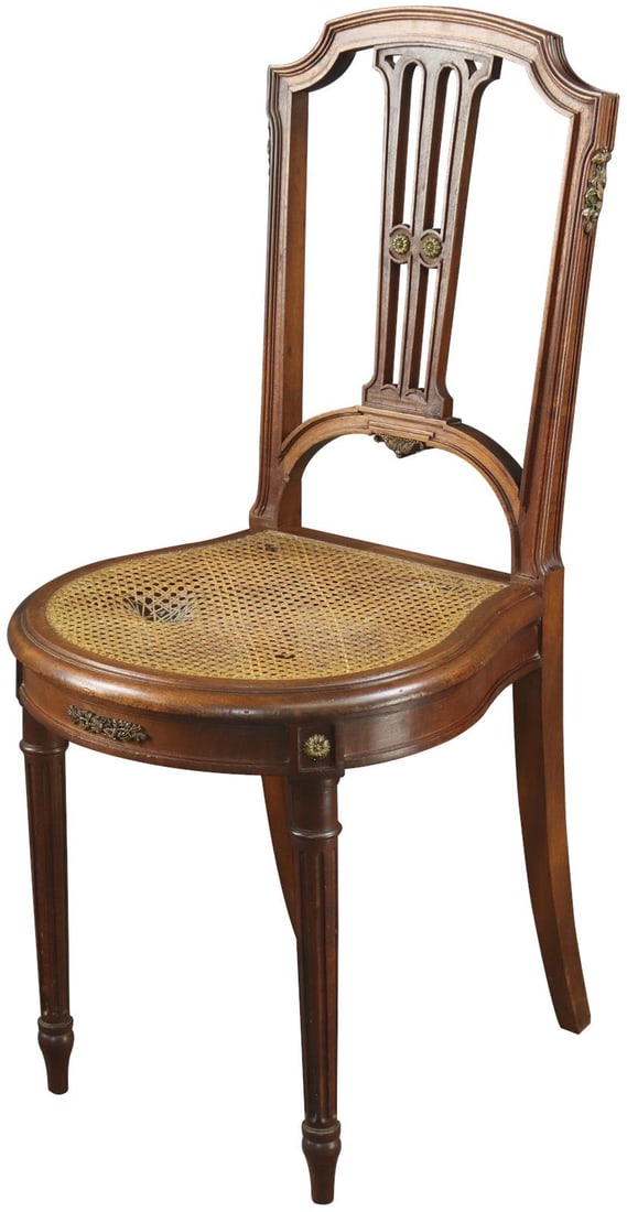 Louis XVI Antique Mahogany Vanity Chair with Cane Seat 1900: Louis XVI Antique Mahogany Vanity Chair with Cane Seat 1900 This exquisite Antique Mahogany Vanity Chair from France showcases the elegance of Louis XVI style. Crafted from rich mahogany with a caned 