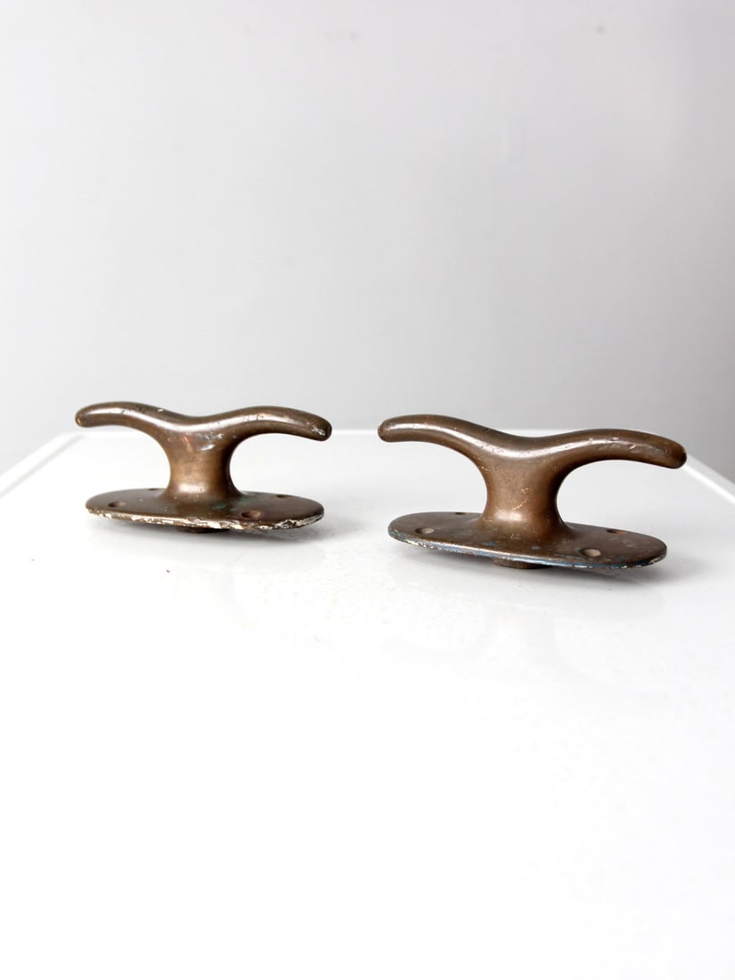 Vintage Brass Boat Cleats Nautical Hardware Pair 8 Inch: Vintage Brass Boat Cleats Nautical Hardware Pair 8 Inch This pair of vintage brass boat cleats is a sturdy addition to any nautical collection. Originally designed to secure rope, these hefty hardware