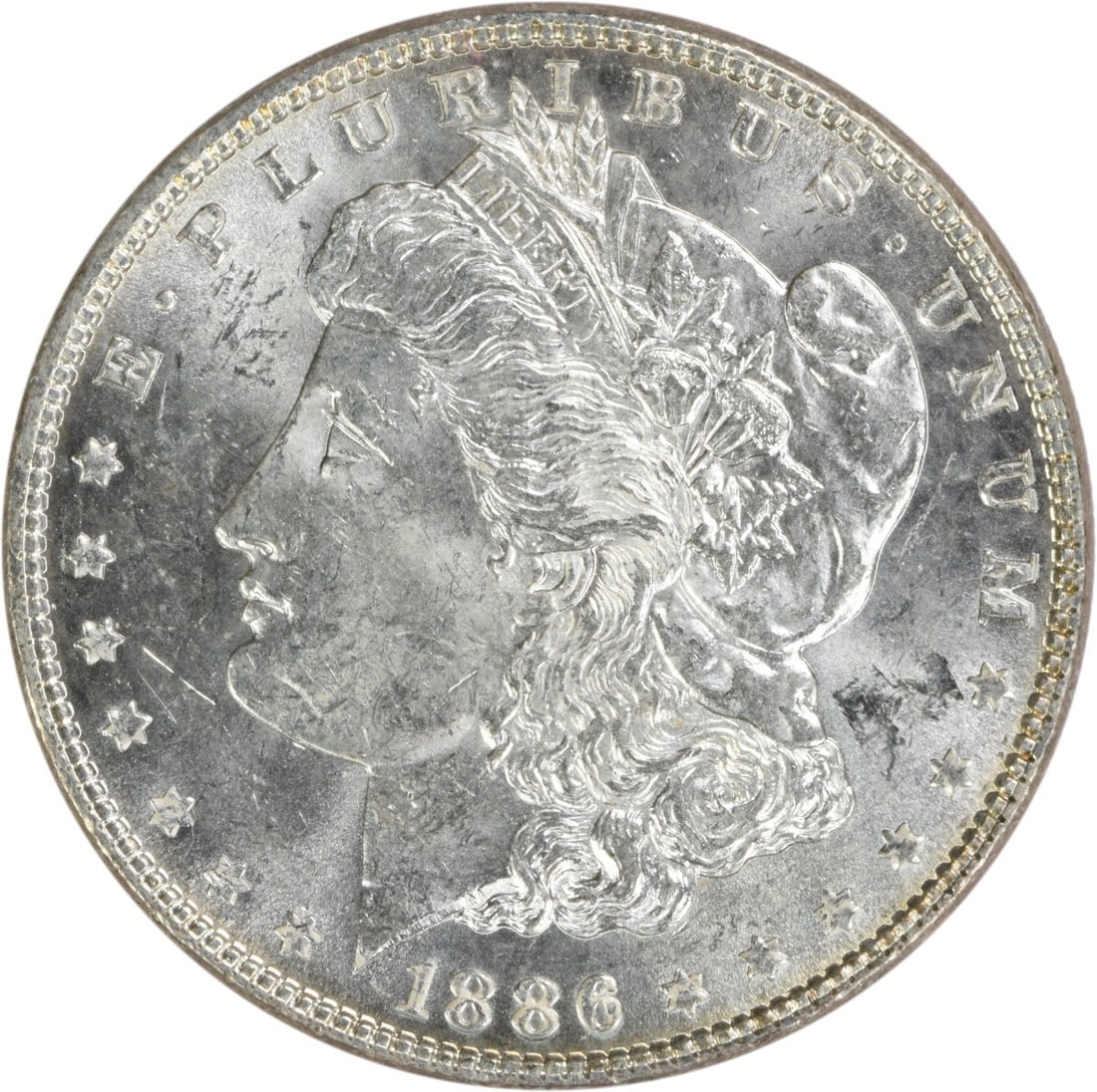 Choice BU 1886 Silver Morgan Dollar Uncertified Philadelphia Mint: Choice BU 1886 Silver Morgan Dollar Uncertified Philadelphia Mint This 1886 Morgan Silver Dollar is an uncirculated coin graded as Choice BU. It is composed of silver and originates from the United St