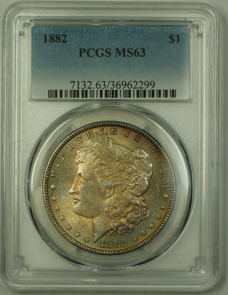 PCGS MS-63 1882 Morgan Dollar Silver $1 Philadelphia Toned Coin: PCGS MS-63 1882 Morgan Dollar Silver $1 Philadelphia Toned Coin This 1882 Morgan Silver Dollar is graded MS-63 by PCGS and features attractive toning. Struck in Philadelphia, the coin is composed of 9