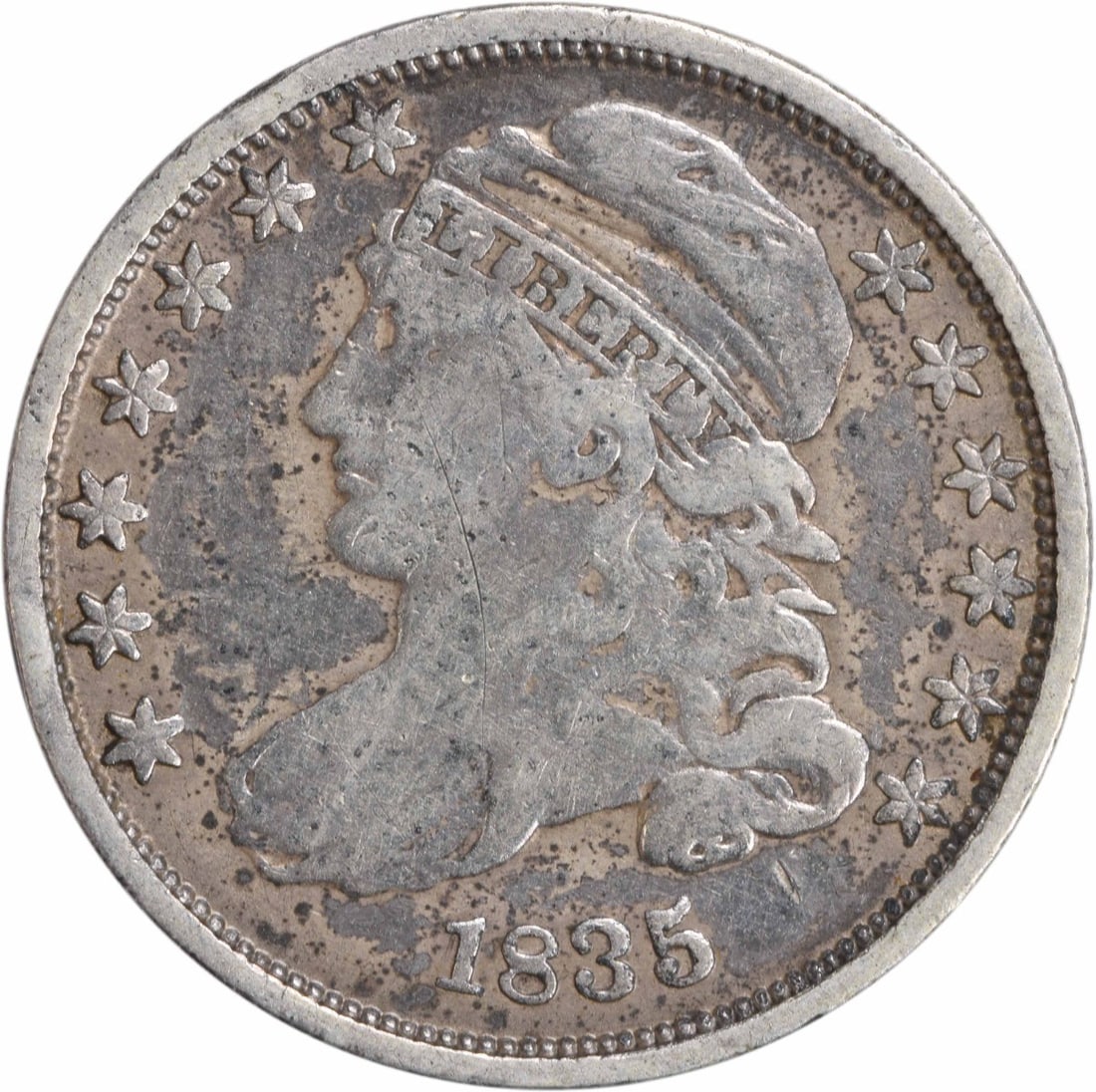 1835 Capped Bust Silver Dime 10C Philadelphia Mint Uncertified: 1835 Capped Bust Silver Dime 10C Philadelphia Mint Uncertified This 1835 Capped Bust Silver Dime is a remarkable piece of numismatic history. Featuring a design by John Reich, this coin was minted in 