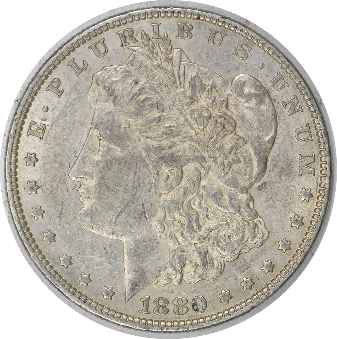 1880-O Morgan Silver Dollar AU Uncertified 90% Silver Coin: 1880-O Morgan Silver Dollar AU Uncertified 90% Silver Coin This 1880-O Morgan Silver Dollar is a beautiful example of American coinage. It features a composition of 90% silver and 10% copper,