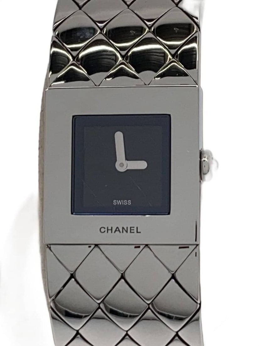 Chanel Matelasse Stainless Steel Quartz Wristwatch H0009: Chanel Matelasse Stainless Steel Quartz Wristwatch H0009 This CHANEL Matelasse women's wristwatch features a quartz movement and a stainless steel case and band. Made in Switzerland, the watch is desi