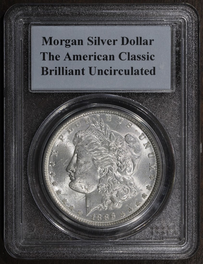 PCGS 1886 Morgan Silver Dollar Philadelphia Uncirculated: PCGS 1886 Morgan Silver Dollar Philadelphia Uncirculated This 1886 Morgan Dollar is a classic American coin, struck in silver with a fineness of 0.9. Graded as Brilliant Uncirculated by PCGS, it was m