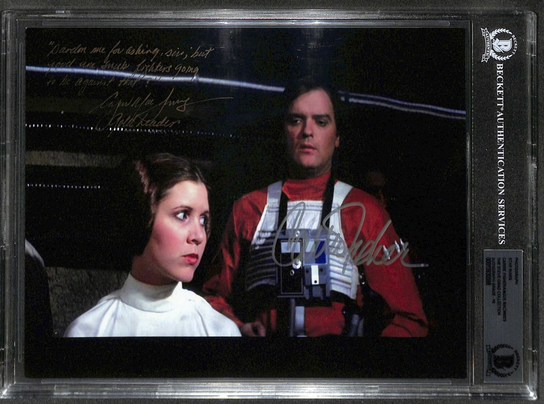Carrie Fisher Angus MacInnes Star Wars ANH Signed Photo with Inscription Beckett 10: Carrie Fisher Angus MacInnes Star Wars ANH Signed Photo with Inscription Beckett 10 This autographed 8x10 photograph features Carrie Fisher as Princess Leia and Angus MacInnes as Dutch Vander from Sta