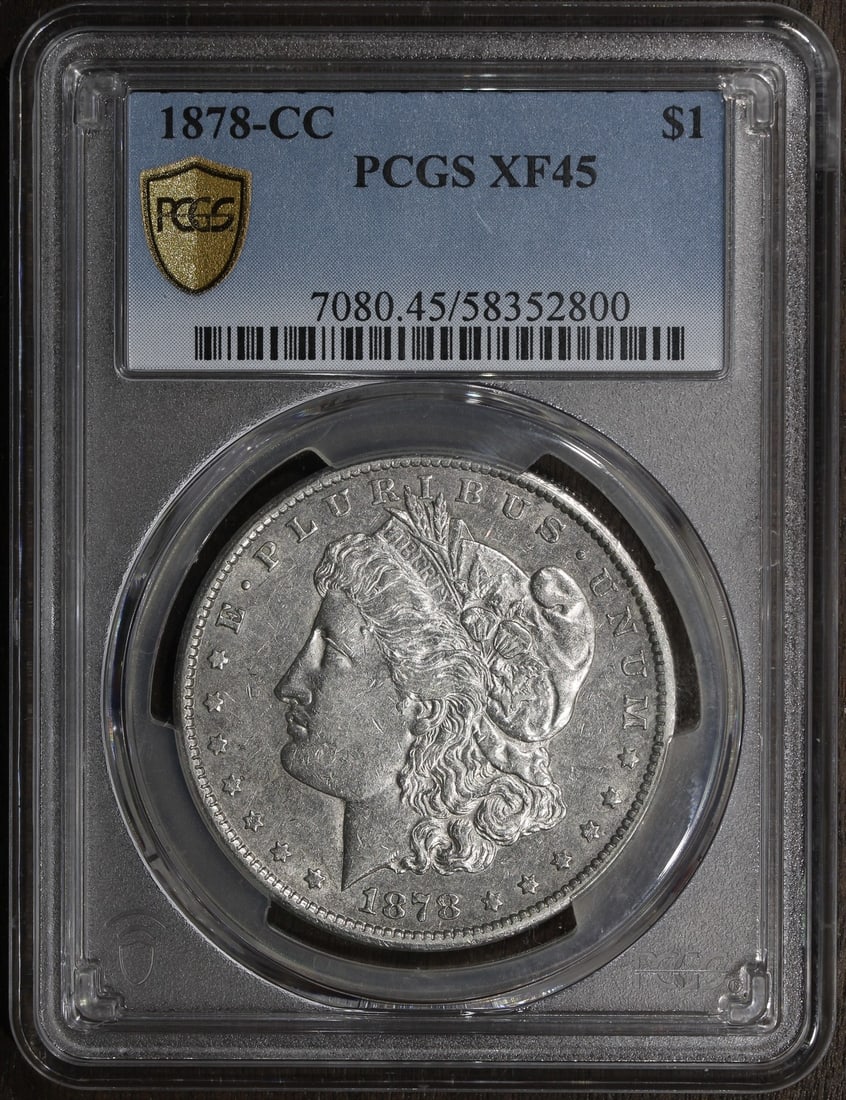PCGS XF45 Carson City Morgan Dollar 1878-CC Silver: PCGS XF45 Carson City Morgan Dollar 1878-CC Silver This is an 1878-CC Morgan Silver Dollar graded XF45 by PCGS. Struck at the Carson City Mint, this circulated coin is composed of 90% silver and repre