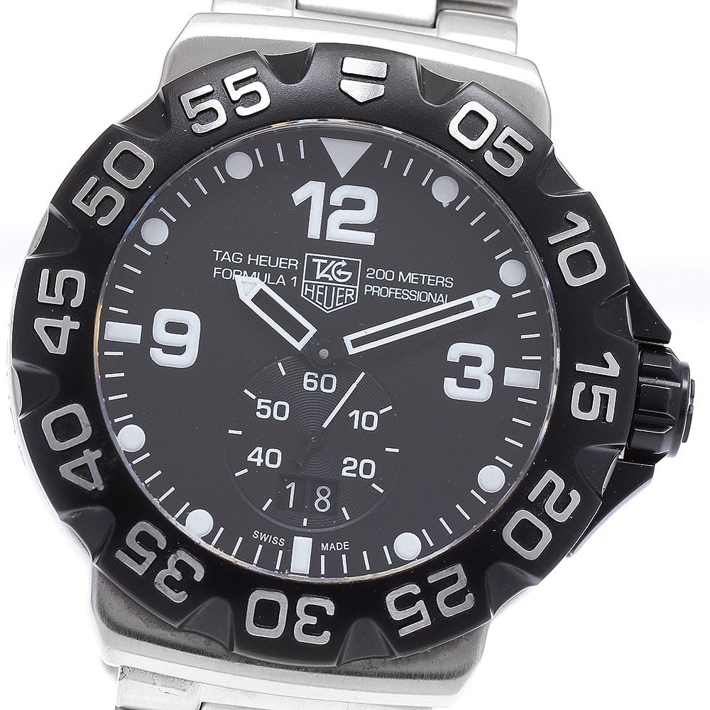 TAG Heuer Formula 1 Grand Date Quartz Men's Wristwatch: TAG Heuer Formula 1 Grand Date Quartz Men's Wristwatch This TAG Heuer Formula 1 Grand Date men's wristwatch features a stainless steel case and bracelet with a black dial. It operates with a quartz mo