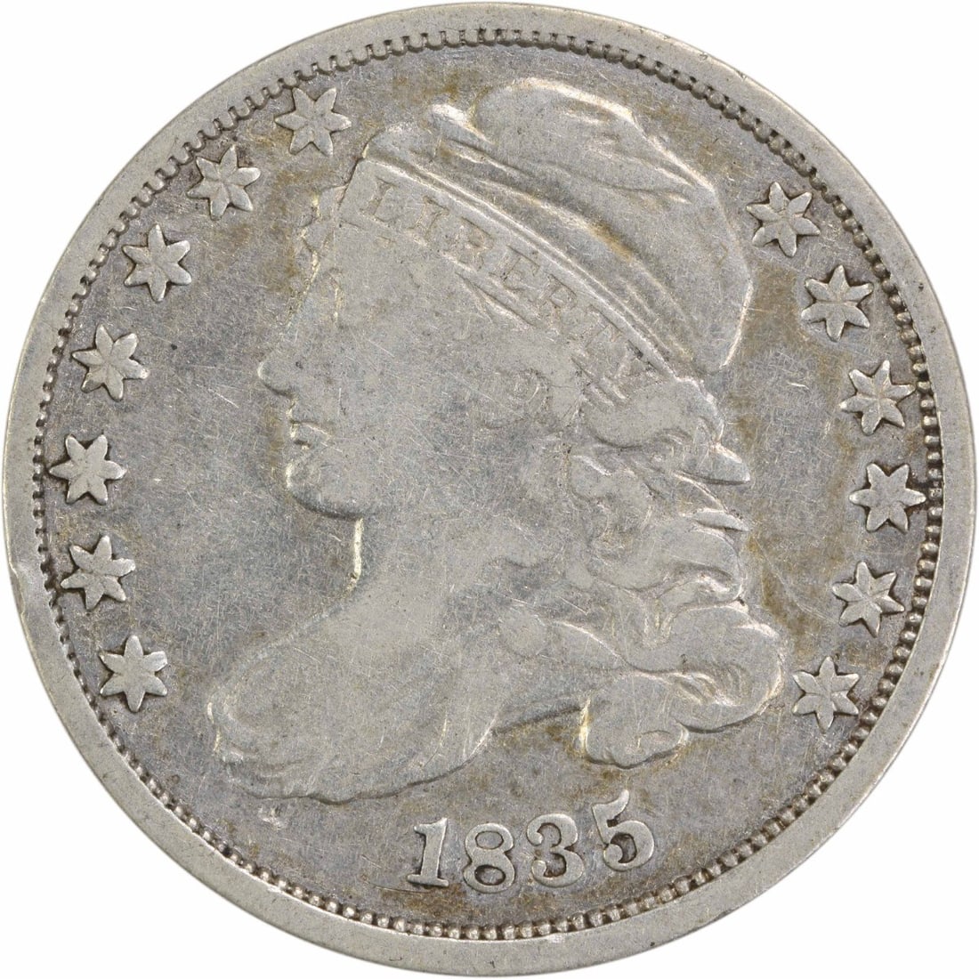 1835 Capped Bust Silver Dime 10C F Uncertified Philadelphia: 1835 Capped Bust Silver Dime 10C F Uncertified Philadelphia This 1835 Capped Bust Silver Dime showcases a rich history, featuring the intricate design by John Reich. The coin is circulated and has a g