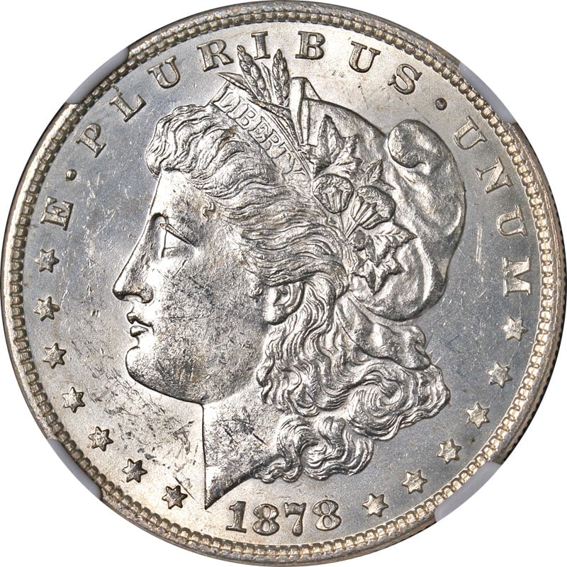 1878-P Morgan Silver Dollar NGC MS61 Uncirculated With Nice Luster: 1878-P Morgan Silver Dollar NGC MS61 Uncirculated With Nice Luster This 1878-P 7TF Rev 79 Morgan Silver Dollar showcases impressive eye appeal, characterized by its nice luster and strong strike. The 