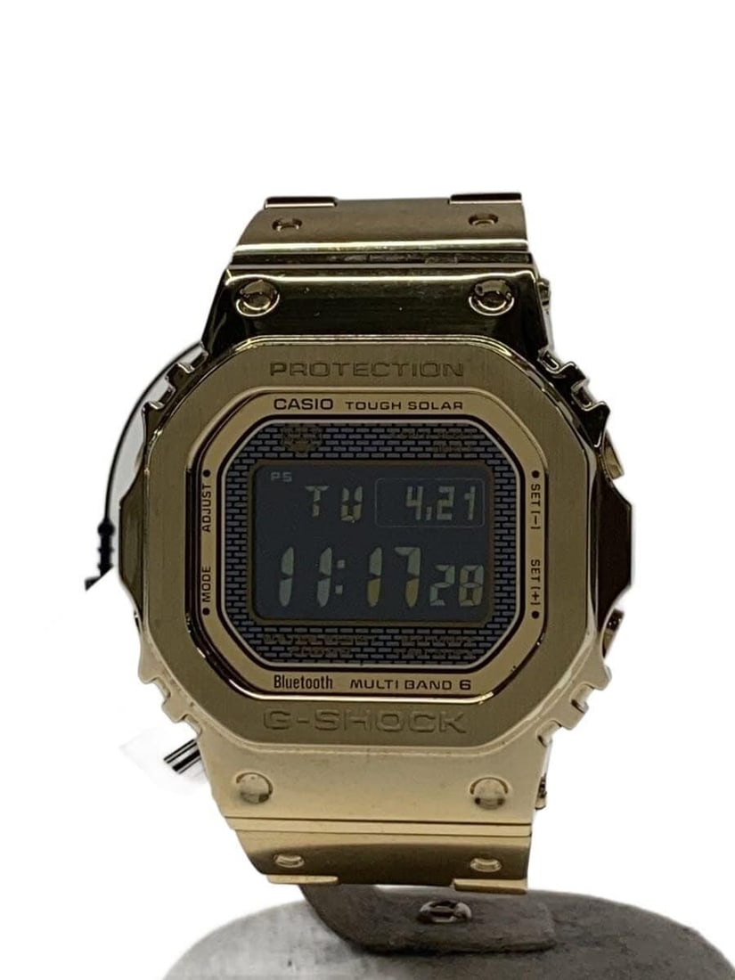 Casio G-Shock GMW-B5000GD-9JF Gold Stainless Steel Wristwatch: Casio G-Shock GMW-B5000GD-9JF Gold Stainless Steel Wristwatch This CASIO G-SHOCK Full Metal Tough Solar GMW-B5000GD-9JF men's wristwatch features a gold-tone stainless steel case and band, offering bo