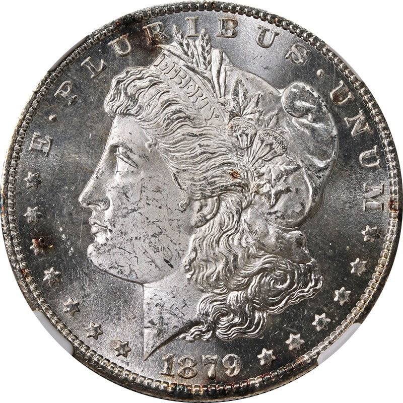 NGC MS64 1879-S Morgan Dollar with Toned Surfaces: NGC MS64 1879-S Morgan Dollar with Toned Surfaces This 1879-S Morgan Silver Dollar is graded MS64 by NGC and features a few spots of toning on both sides. The coin is uncirculated and composed of silv