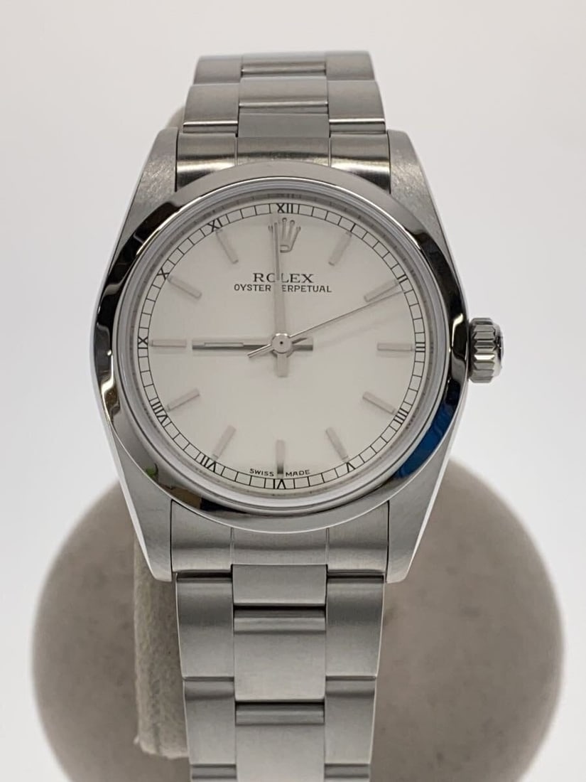 Rolex Oyster Perpetual 77080 Swiss Men's Wristwatch: Rolex Oyster Perpetual 77080 Swiss Men's Wristwatch This ROLEX Oyster Perpetual 77080 is a men's Swiss-made wristwatch featuring a classic design. The watch is pre-owned and graded as Grade B, indicat