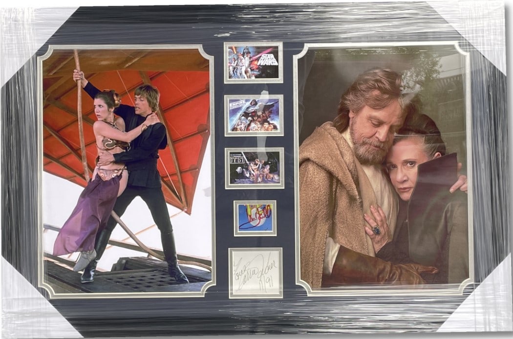 Star Wars 34x22 Framed Mark Hamill Carrie Fisher Signed Display JSA Authenticated: Star Wars 34x22 Framed Mark Hamill Carrie Fisher Signed Display JSA Authenticated This custom-framed display features autographed cut signatures from Mark Hamill and Carrie Fisher, celebrated stars of