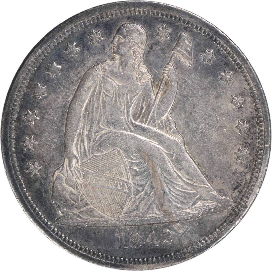 1842 United States Seated Liberty Dollar 90 Percent Silver AU Uncertified: 1842 United States Seated Liberty Dollar 90 Percent Silver AU Uncertified This 1842 Liberty Seated Silver Dollar features the historic design by Christian Gobrecht. Struck at the Philadelphia Mint, th
