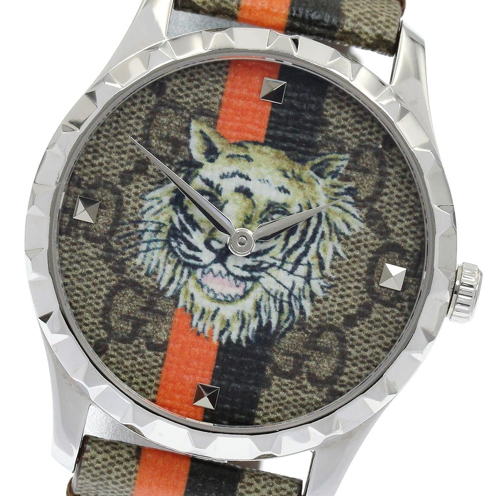 Gucci G Timeless Tiger quartz unisex wristwatch band only: Gucci G Timeless Tiger quartz unisex wristwatch band only This Gucci G-Timeless Tiger Quartz wristwatch features a stainless steel case paired with a leather band, designed for unisex wear. The dial s
