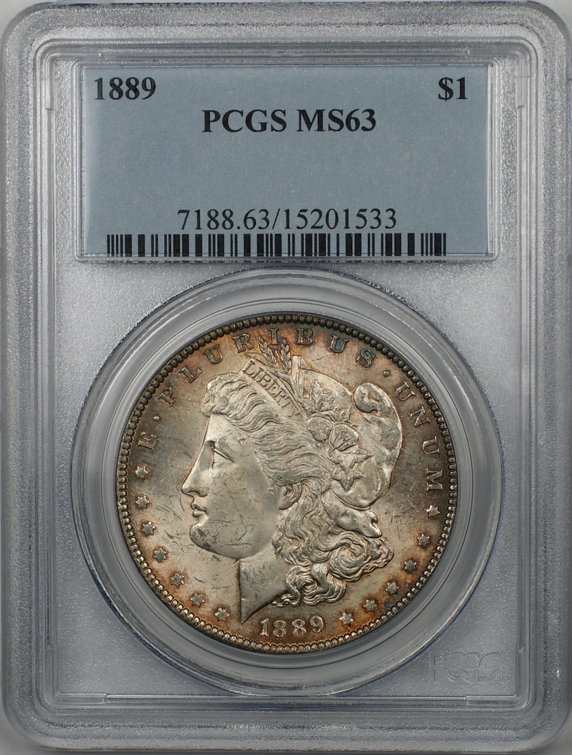 PCGS MS63 1889 Morgan silver dollar toned: PCGS MS63 1889 Morgan silver dollar toned This 1889 Morgan Silver Dollar is graded MS-63 by PCGS and features attractive toning. The coin is composed of silver, minted in Philadelphia, and remains in 