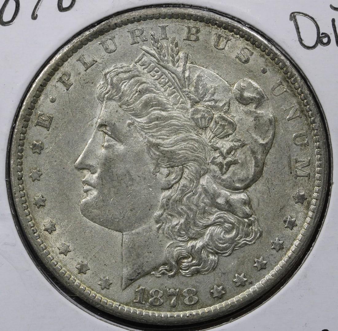 Carson City 1878 Morgan Silver Dollar AU: Carson City 1878 Morgan Silver Dollar AU This is an 1878-CC Morgan Silver Dollar from the Carson City Mint. The coin is composed of 0.9 fineness silver and has a denomination of $1. It is a circulated