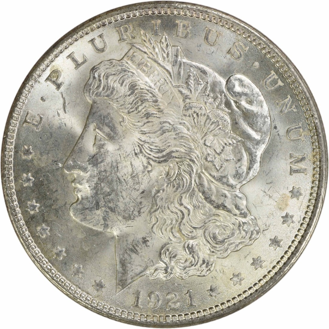 1921 Silver Morgan Dollar Brilliant Uncirculated Uncertified US Coin: 1921 Silver Morgan Dollar Brilliant Uncirculated Uncertified US Coin This is a 1921 Morgan Silver Dollar from the United States, featuring a brilliant uncirculated (BU) grade. The coin is composed of 