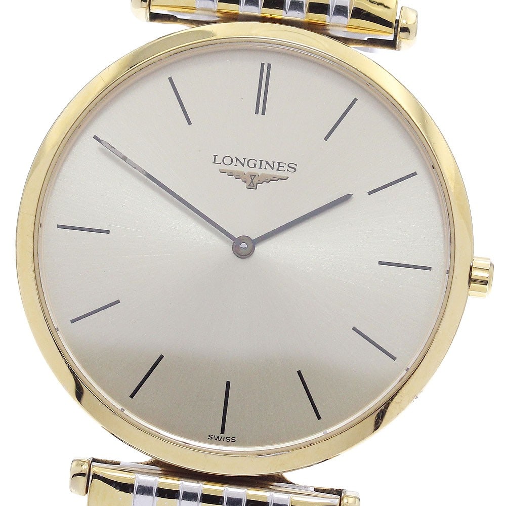 Longines Grand Classic L4.709.2 Quartz Gold Tone Men's Wristwatch: Longines Grand Classic L4.709.2 Quartz Gold Tone Men's Wristwatch This Longines Grand Classic Quartz men's wristwatch, model L4.709.2, features a stainless steel and gold case and band with a gold dia