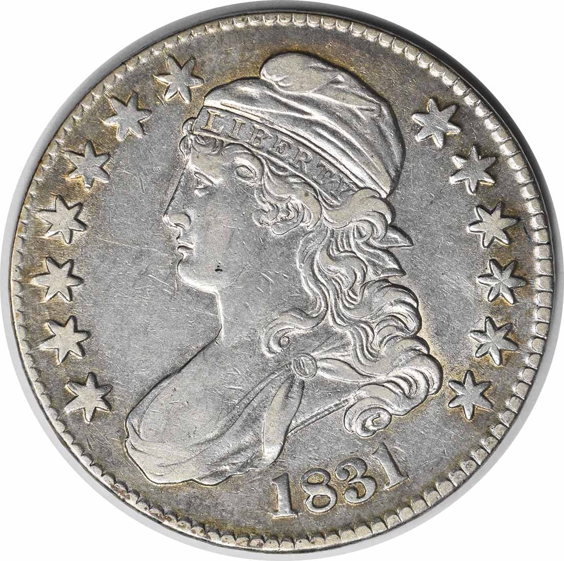 1831 Philadelphia Capped Bust 50C Silver Half Dollar XF Uncertified: 1831 Philadelphia Capped Bust 50C Silver Half Dollar XF Uncertified This 1831 Bust Half Dollar from the United States is a circulated coin featuring the design by John Reich. Struck at the Philadelphi