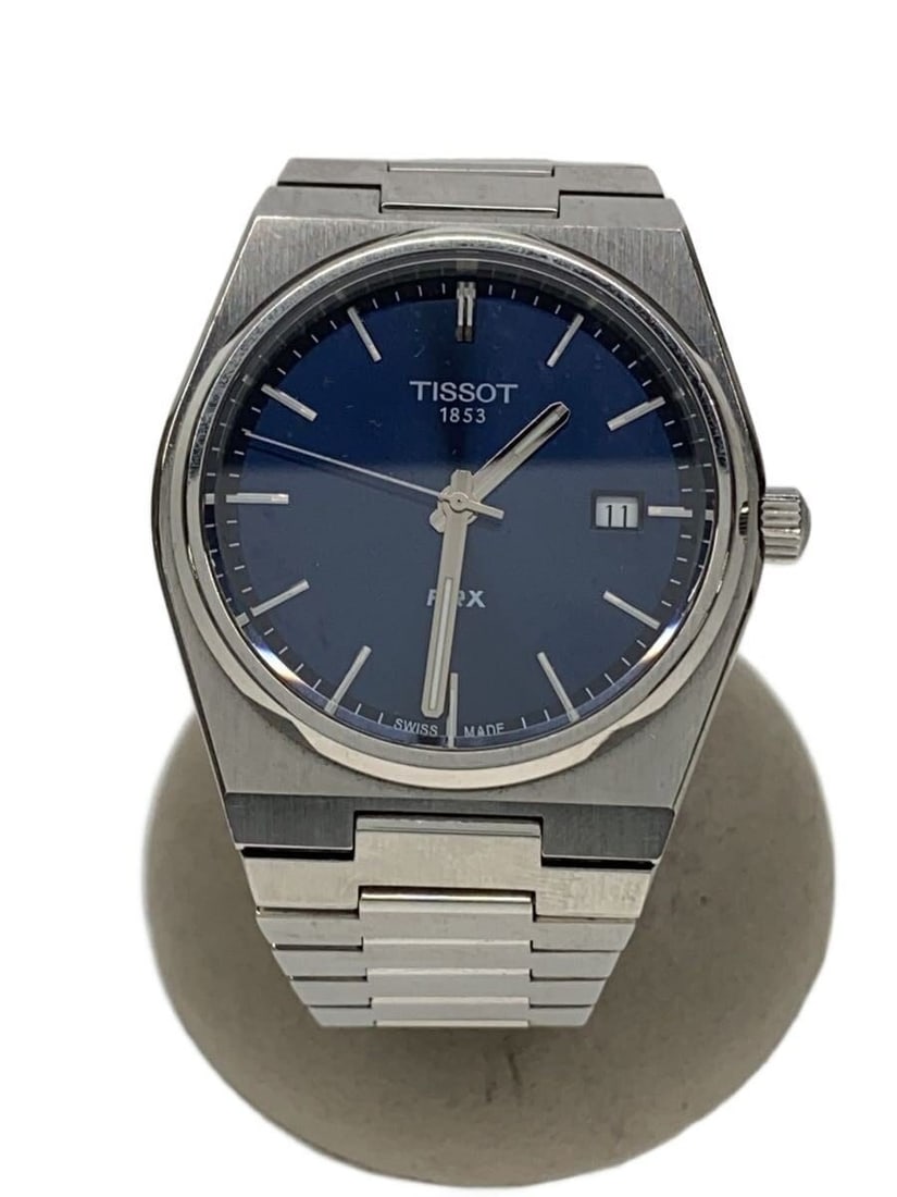 Tissot PRX Quartz Steel Men's Wristwatch T137410A: Tissot PRX Quartz Steel Men's Wristwatch T137410A This TISSOT PRX Quartz wristwatch is crafted from stainless steel and designed for men. Made in Switzerland, it features a quartz movement and display