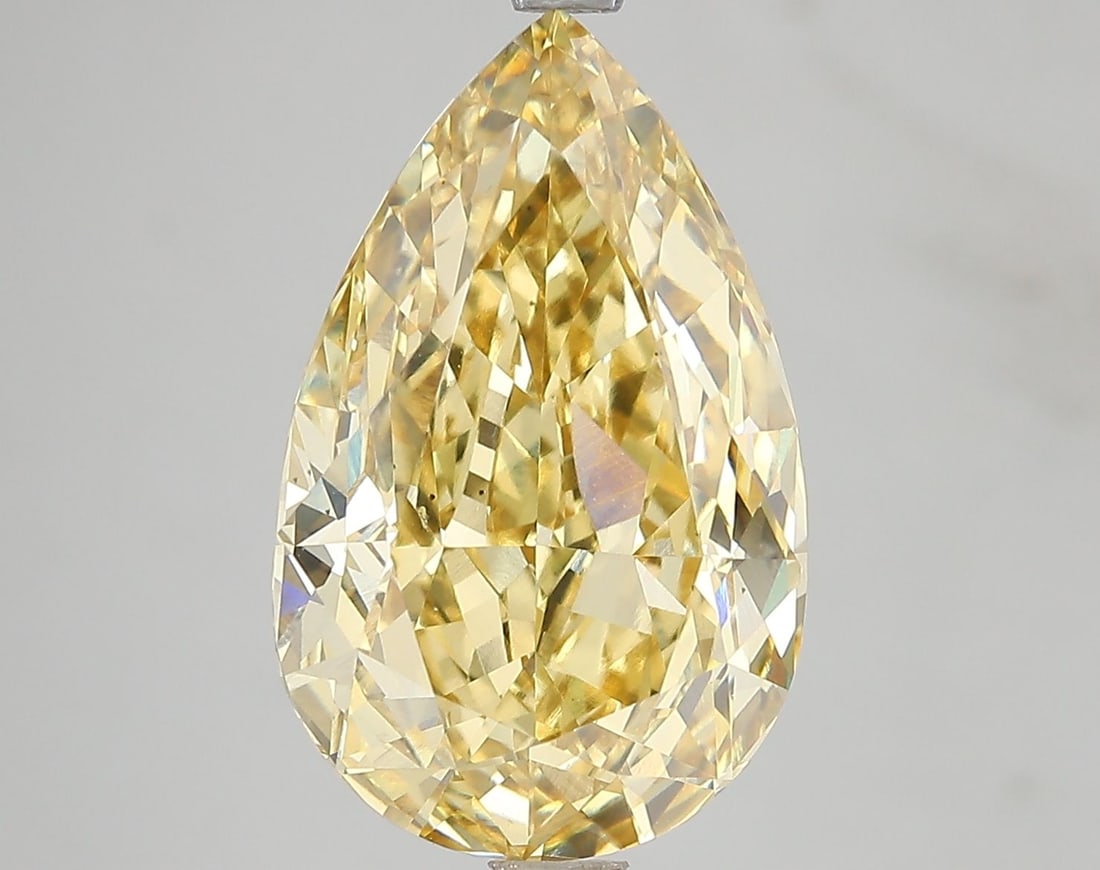 Loose Diamond - PEAR 7.16ct Fancy Vivid Yellow VS2: Loose Diamond - PEAR 7.16ct Fancy Vivid Yellow VS2 Source: This is a real non-mined Diamond that has been grown in a lab Shape: PEAR Carats: 7.16 Color: Fancy Vivid Yellow Certification: IGI Video: