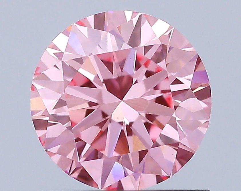 Loose Diamond - ROUND 0.9ct Fancy Vivid Pink VS1: Loose Diamond - ROUND 0.9ct Fancy Vivid Pink VS1 Source: This is a real non-mined Diamond that has been grown in a lab Shape: ROUND Carats: 0.9 Color: Fancy Vivid Pink Certification: IGI Additional im