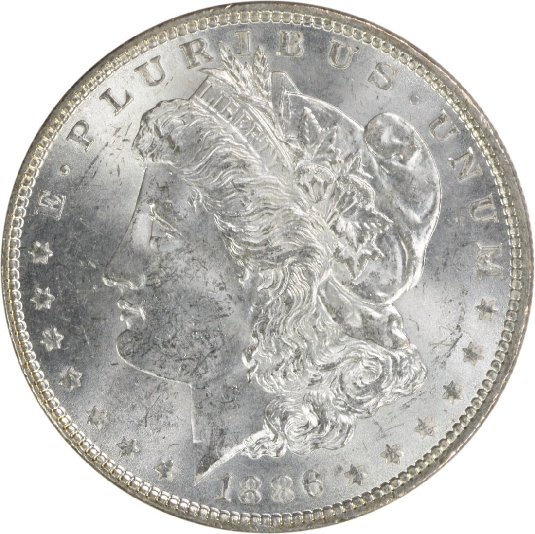 Uncirculated 1886 Silver Morgan Dollar Brilliant Uncirculated No Mint Mark: Uncirculated 1886 Silver Morgan Dollar Brilliant Uncirculated No Mint Mark This is an 1886 Morgan Silver Dollar from the United States, featuring a brilliant uncirculated (BU) grade. The coin is compo