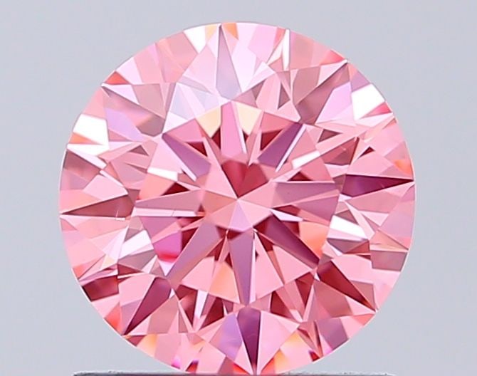 Ideal Loose Diamond - ROUND 1.06ct Fancy Vivid Pink VS2: Ideal Loose Diamond - ROUND 1.06ct Fancy Vivid Pink VS2 Source: This is a real non-mined Diamond that has been grown in a lab Shape: ROUND Carats: 1.06 Color: Fancy Vivid Pink Certification: IGI Video