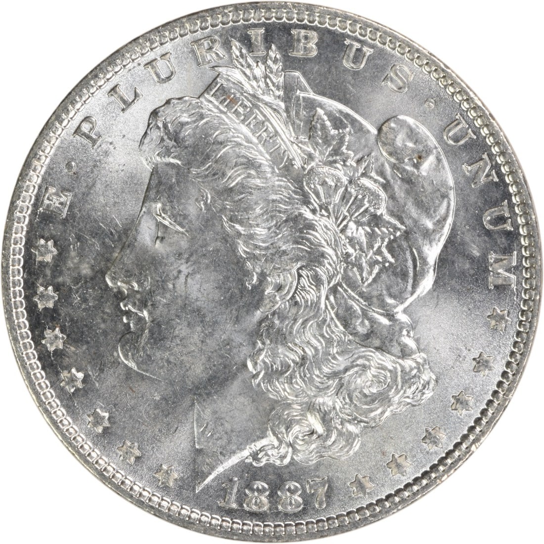 Brilliant Uncirculated 1887 Morgan Silver Dollar Philadelphia No Mint Mark: Brilliant Uncirculated 1887 Morgan Silver Dollar Philadelphia No Mint Mark This is an uncirculated 1887 Morgan Silver Dollar from the United States. The coin is composed of silver and has a denominati