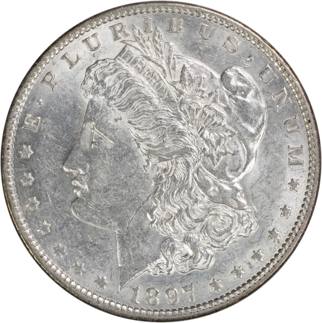 1897 AU Morgan Dollar Philadelphia 90 Silver Uncertified US Coin: 1897 AU Morgan Dollar Philadelphia 90 Silver Uncertified US Coin This is a pre-owned 1897 Morgan Silver Dollar from the United States, struck at the Philadelphia Mint with no mint mark. Composed of 90