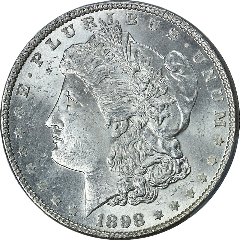 PCGS MS64 Morgan Silver Dollar 1898 Philadelphia Mint Uncirculated: PCGS MS64 Morgan Silver Dollar 1898 Philadelphia Mint Uncirculated This 1898-P Morgan Silver Dollar is certified by PCGS with a grade of MS64. The coin features a blast white appearance, strong strike