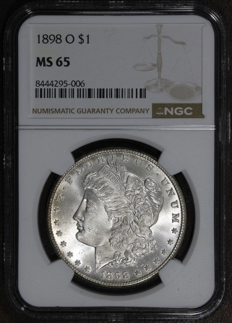 NGC MS65 1898-O Morgan Silver Dollar: NGC MS65 1898-O Morgan Silver Dollar This is an 1898 Morgan Silver Dollar from the New Orleans Mint, graded MS65 by NGC. The coin is uncirculated and composed of 90% silver, making it a collectible ex