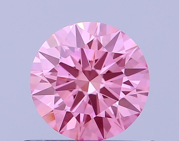 Loose Diamond - ROUND 0.67ct Fancy Vivid Pink VVS2: Loose Diamond - ROUND 0.67ct Fancy Vivid Pink VVS2 Source: This is a real non-mined Diamond that has been grown in a lab Shape: ROUND Carats: 0.67 Color: Fancy Vivid Pink Certification: IGI Video:
