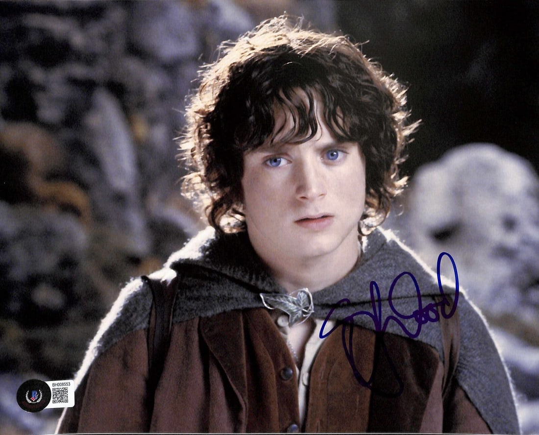 Elijah Wood Frodo Baggins Signed 8x10 Photo Beckett Certified: Elijah Wood Frodo Baggins Signed 8x10 Photo Beckett Certified This is an autographed 8x10 photograph of Elijah Wood, famously known for his role as Frodo Baggins in the iconic movie series, Lord of th